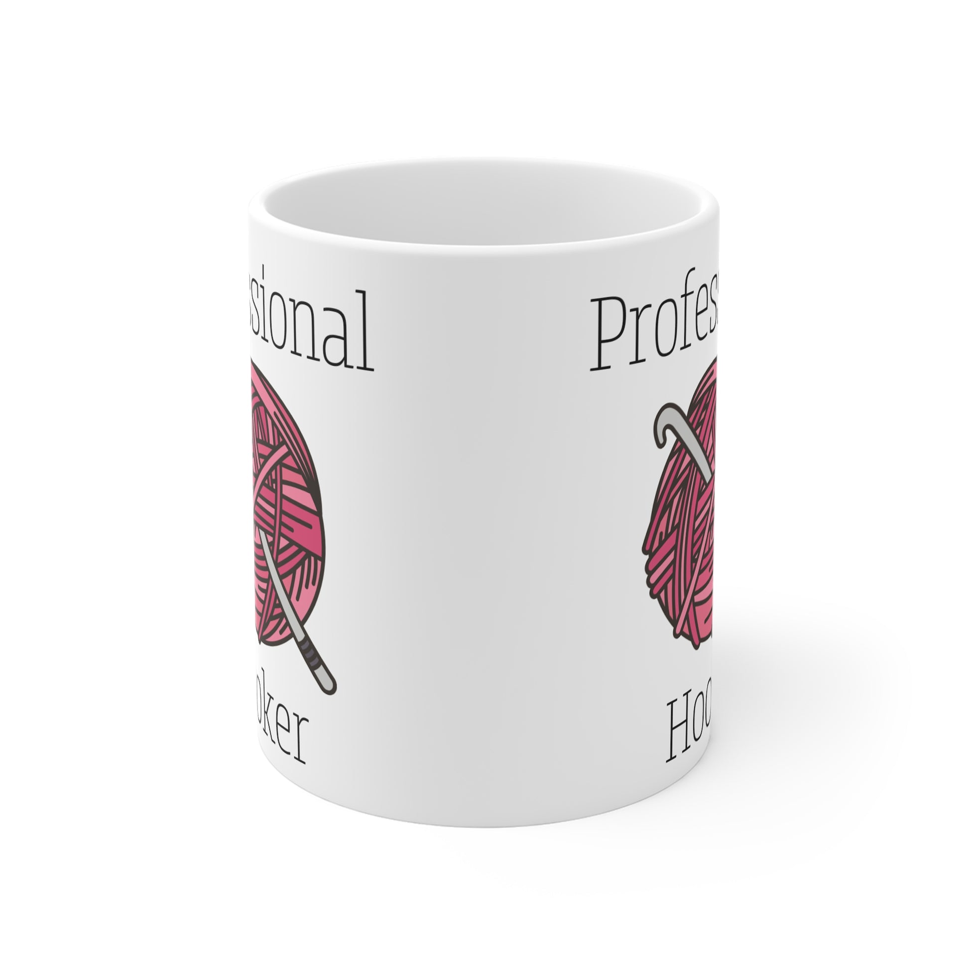White mug with yarn and knitting needle design and text on a white background